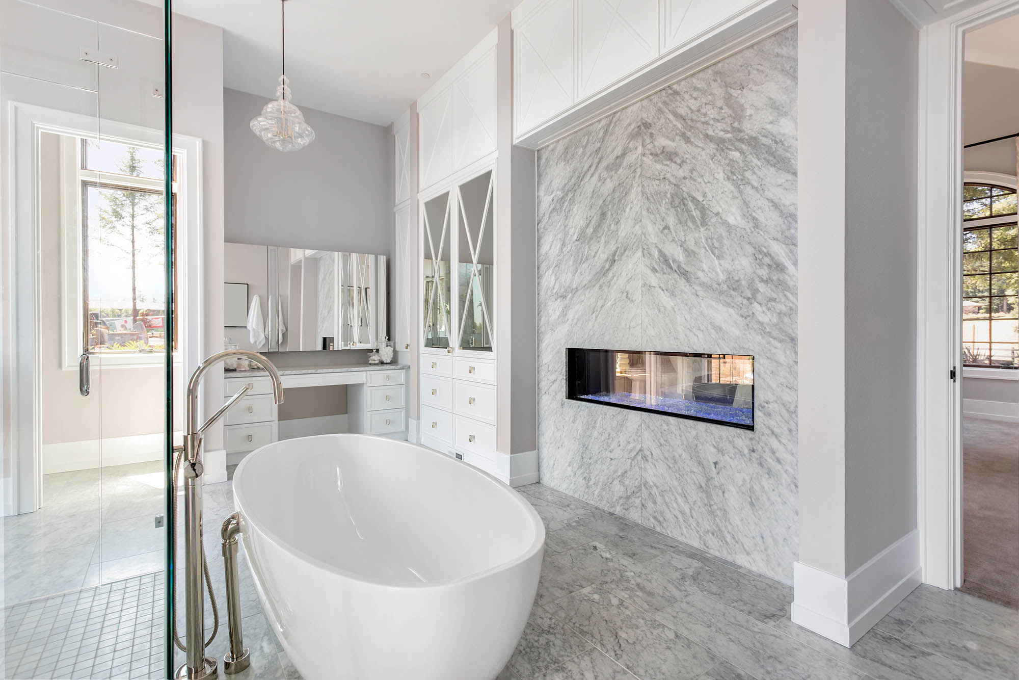New bathtub remodel with built-in fireplace.
